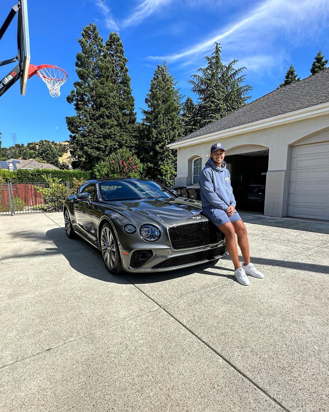 Trey on his luxurious property, parking his black car.